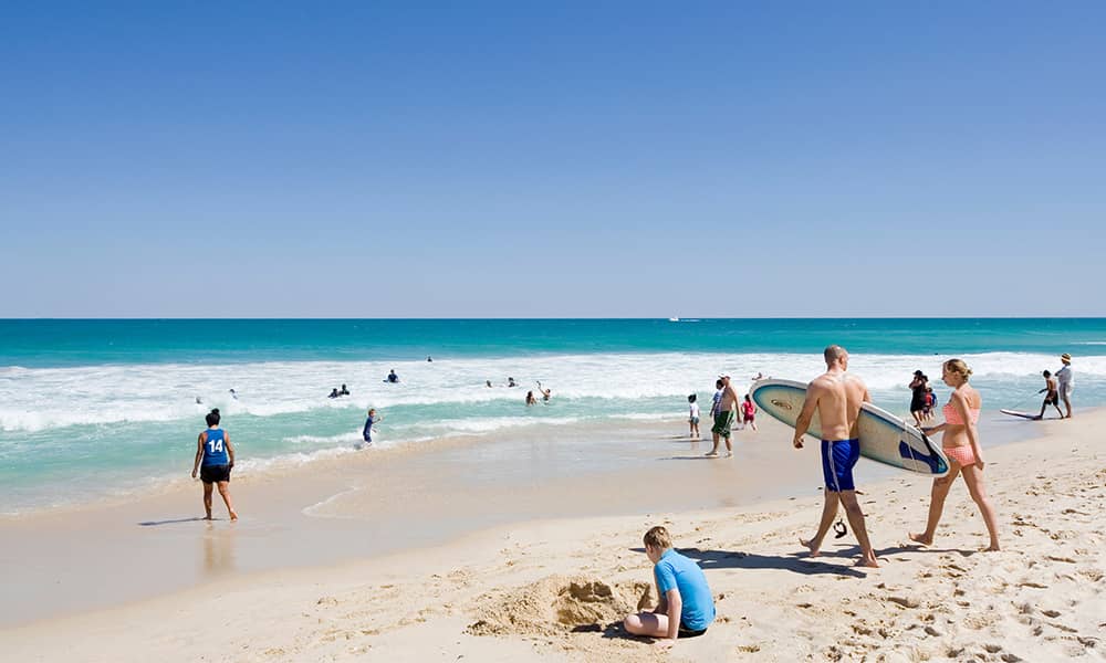Image of man with surfboard