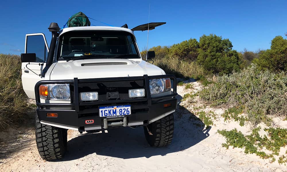 Car parked on sand