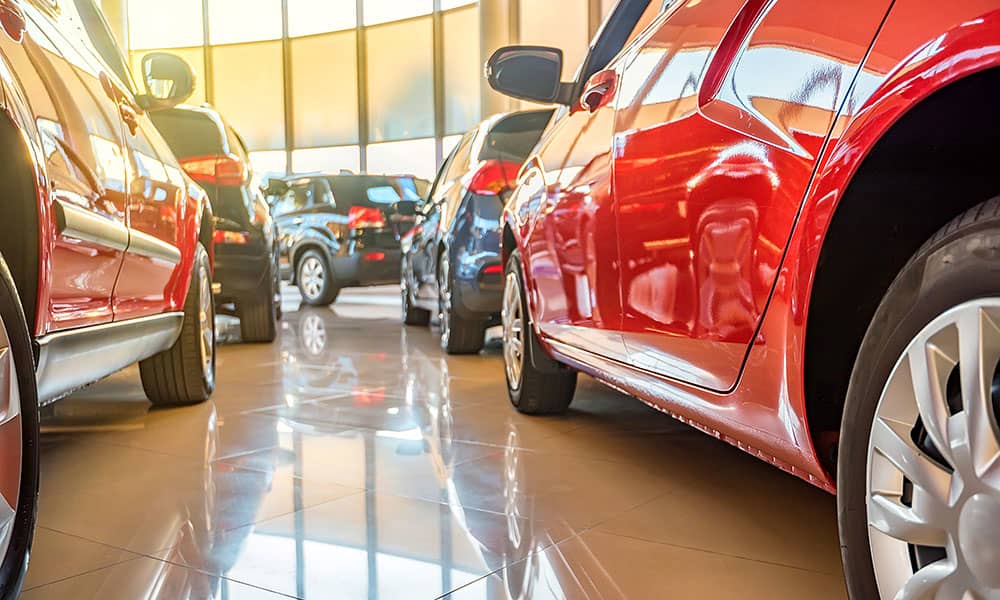 A row of cars in  a car yard