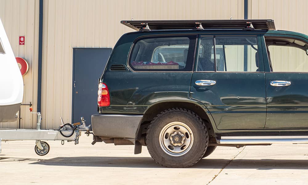 Image of the back of a car hitched to a caravan