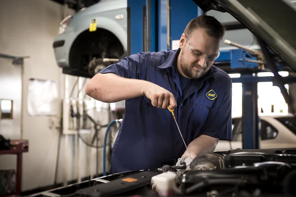 An RAC mechanic servicing a car