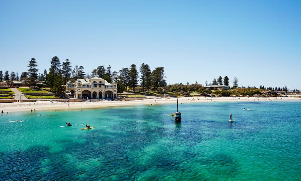 Photo of turquoise water at Cottesloe Beach with Indiana Teahouse in the background