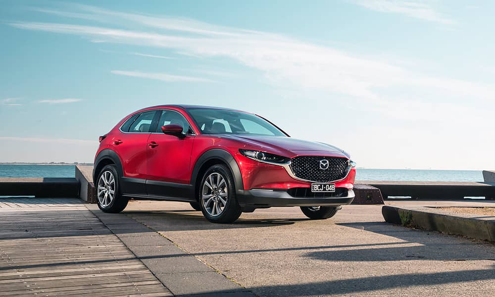 A red Mazda CX-30 X20 hybrid car