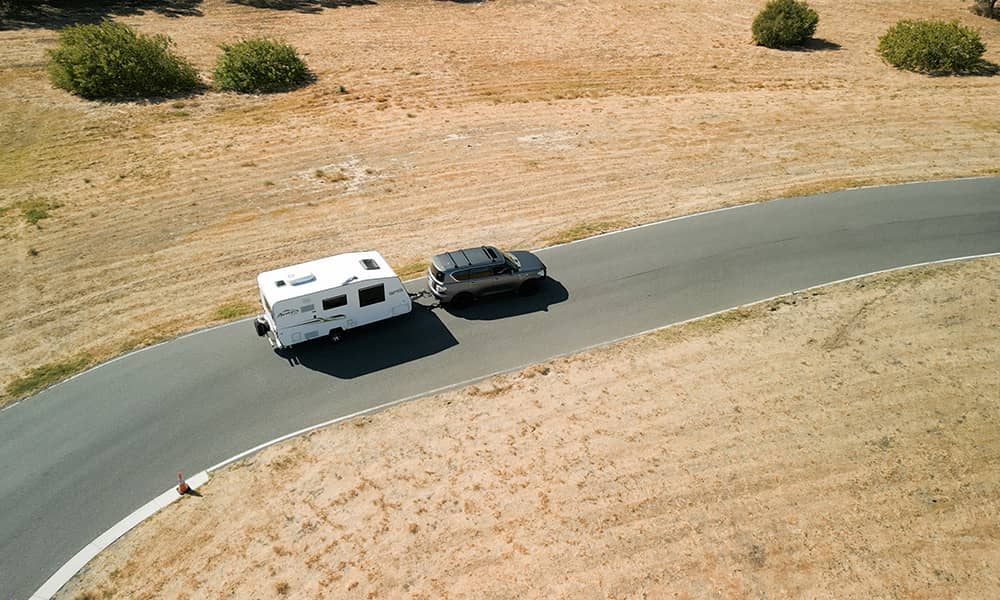A caravan being towed on a road