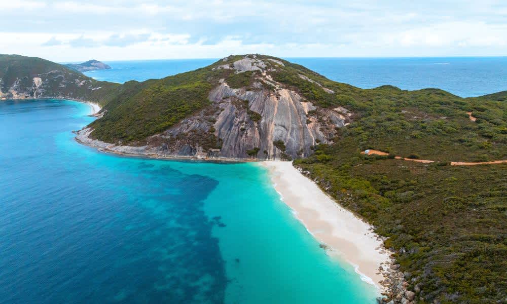 Aerial view of Misery Beach and Bald Head walking trail surrounded by water