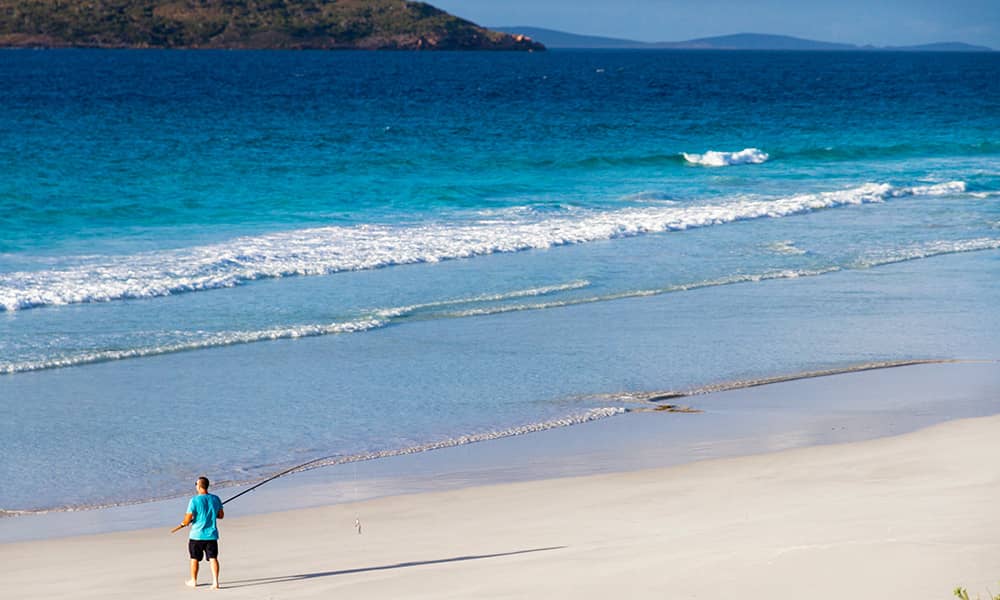 Man fishing on the beach