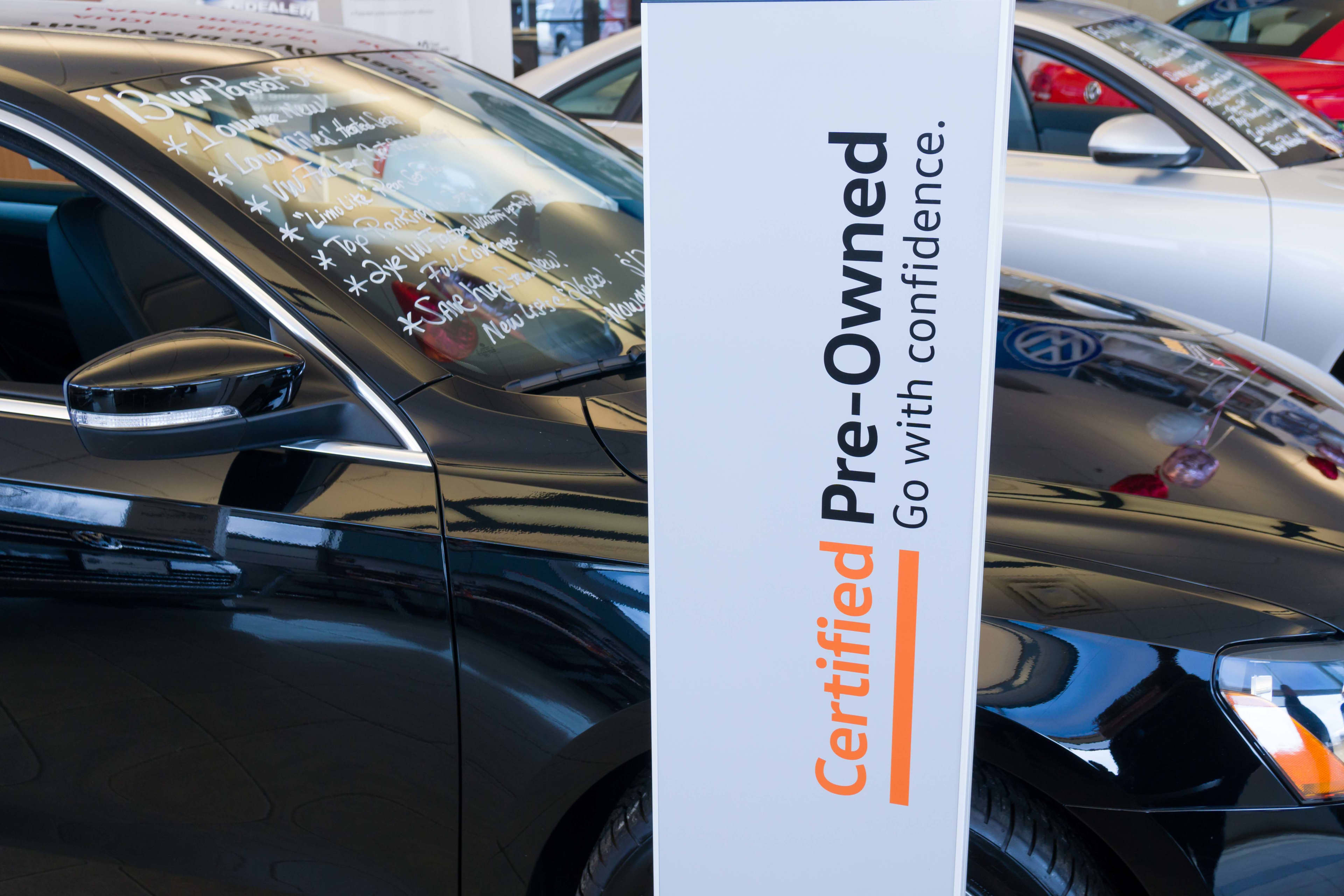 Certified pre-owned car signage at a car dealership