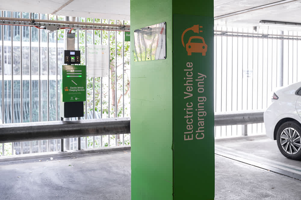 A public EV charging station in a multistorey carpark