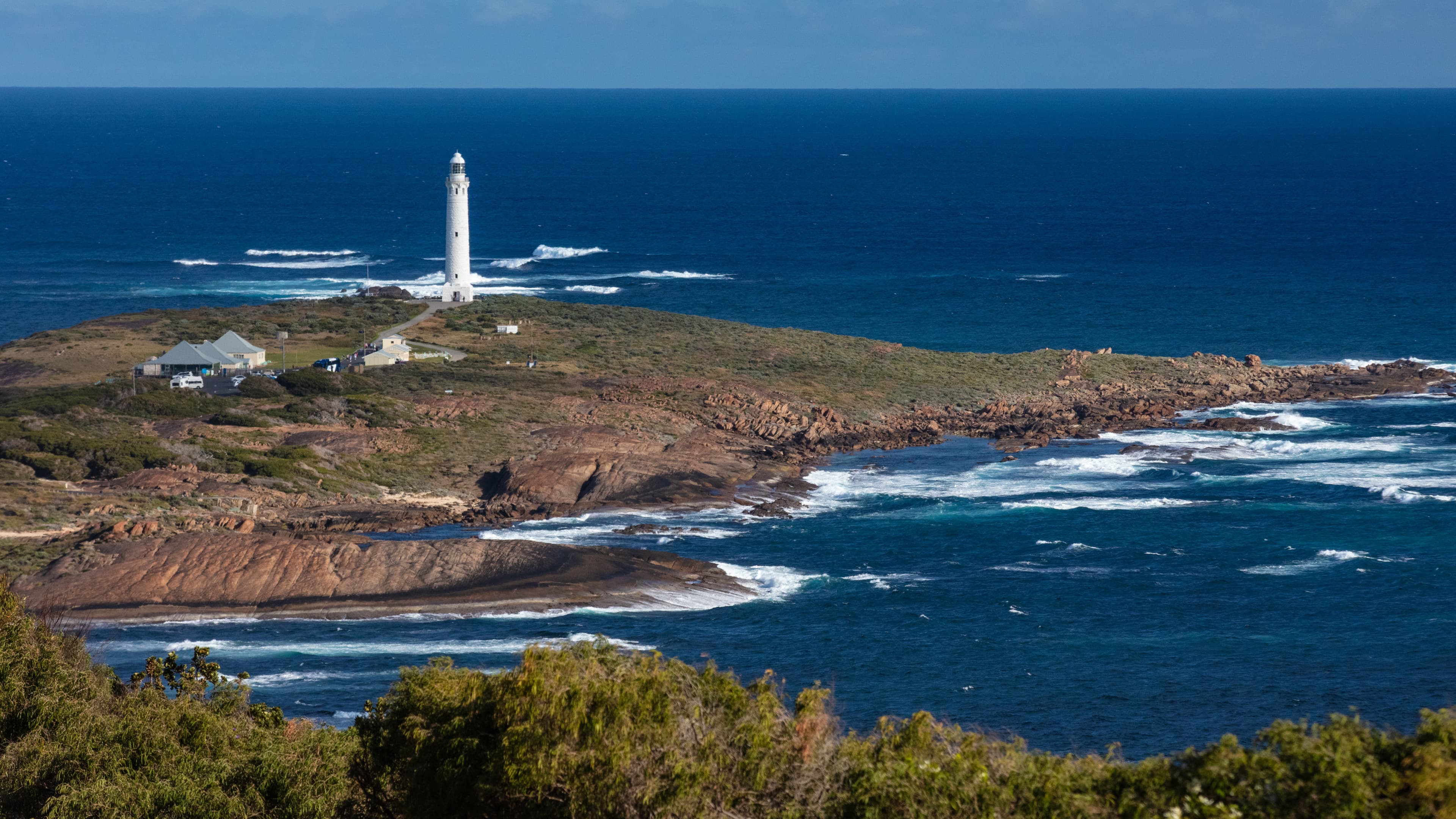 Lighthouse in Augusta with small houses dotted around.