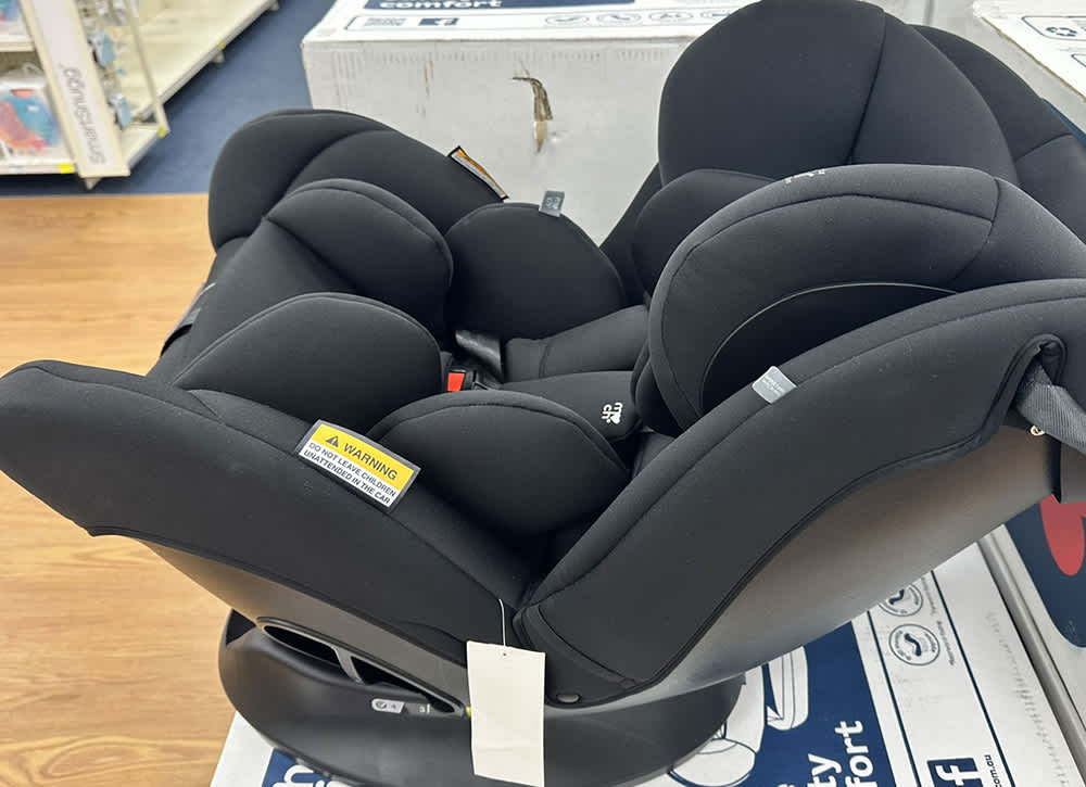 A new child car restraint on display in a store.