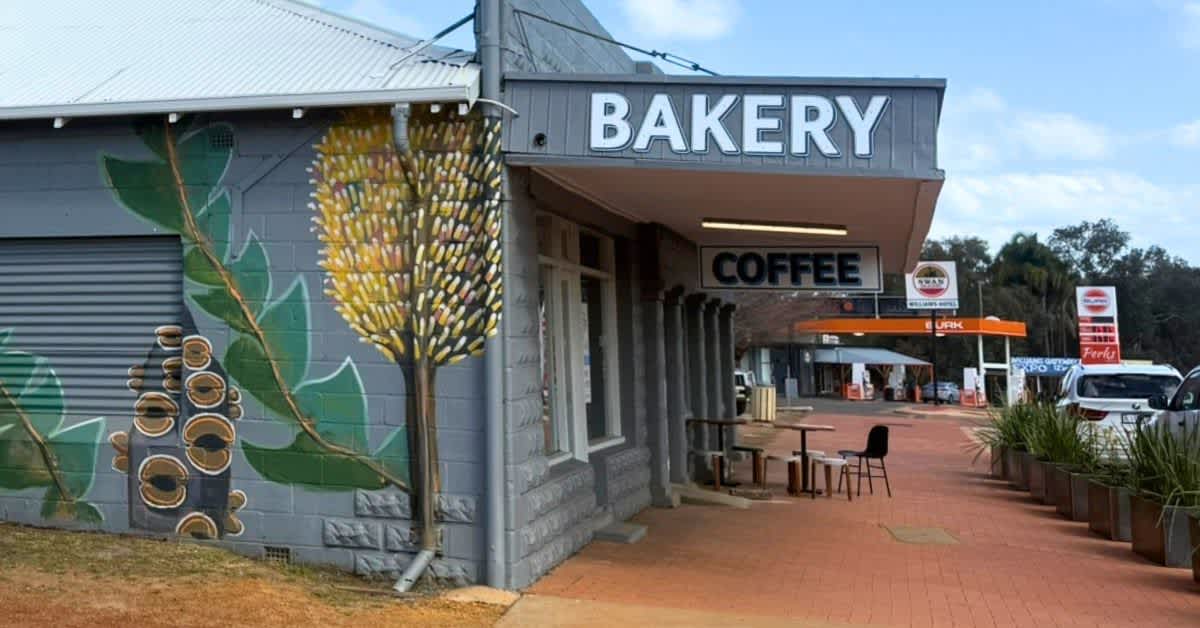 External building with Bakery sign and Australian native wildflower mural on wall
