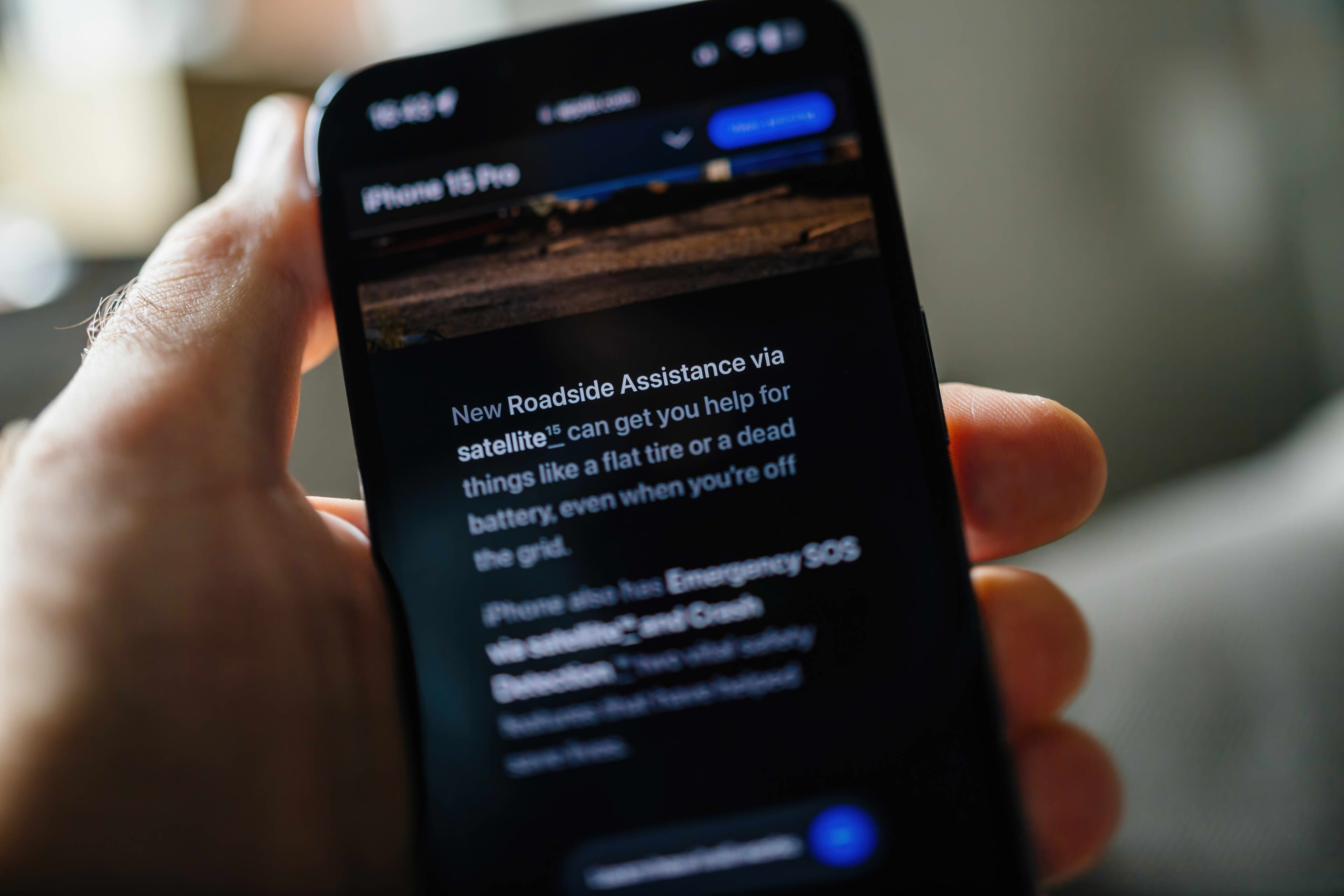 A mobile phone showing Apple's Roadside Assist feature