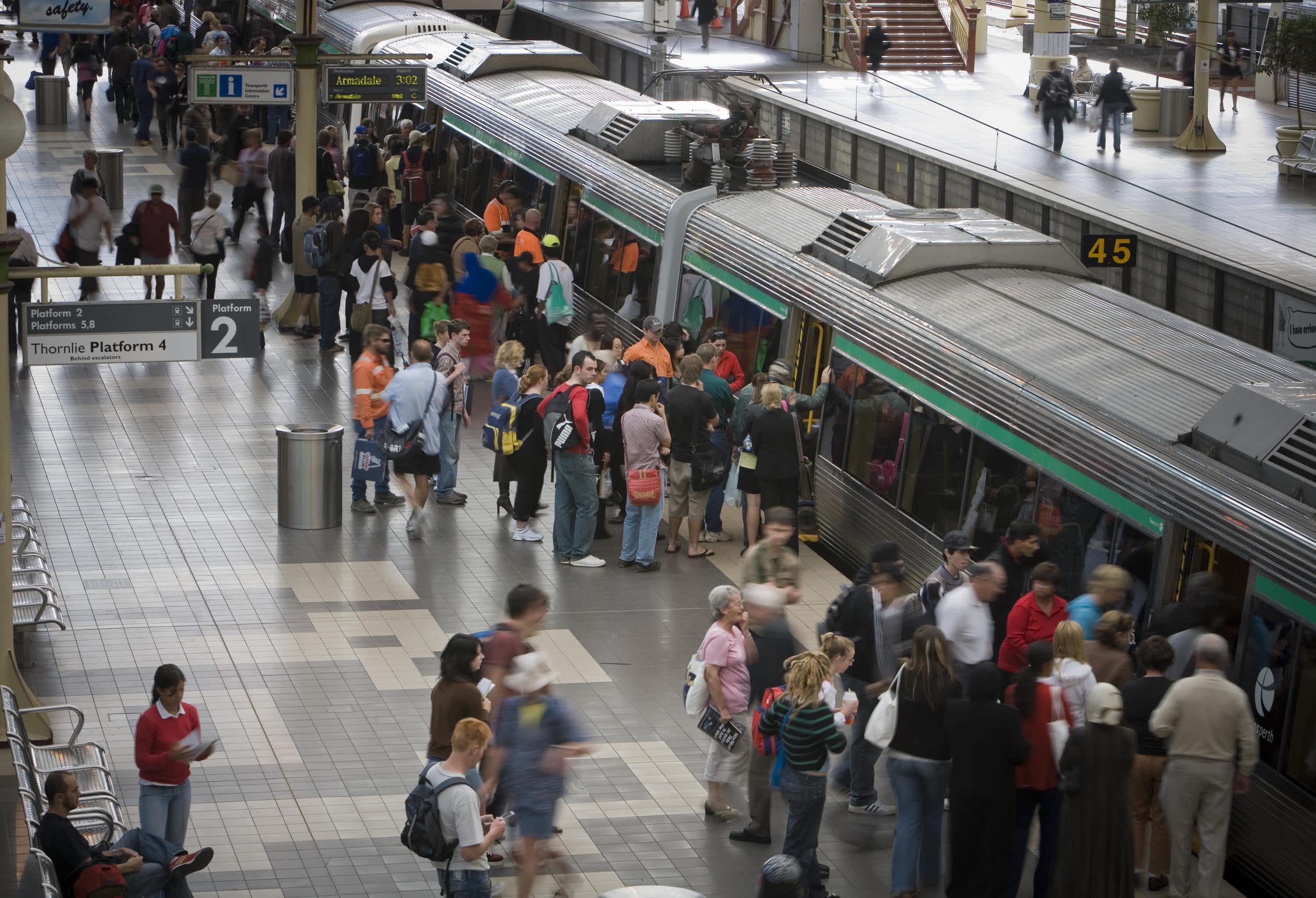 A high view of passengers boarding a Perth train