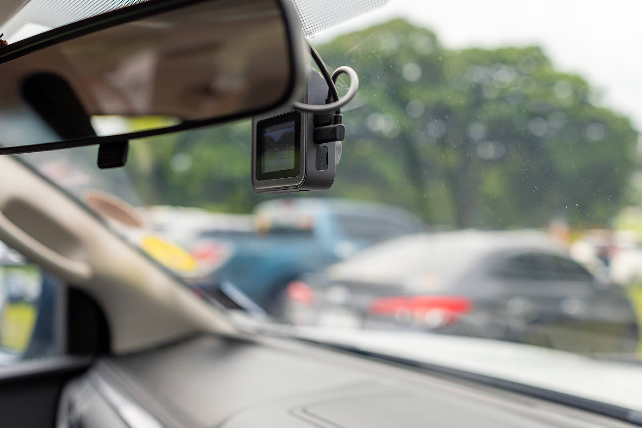 A close up of a dashcam seen from the car interior