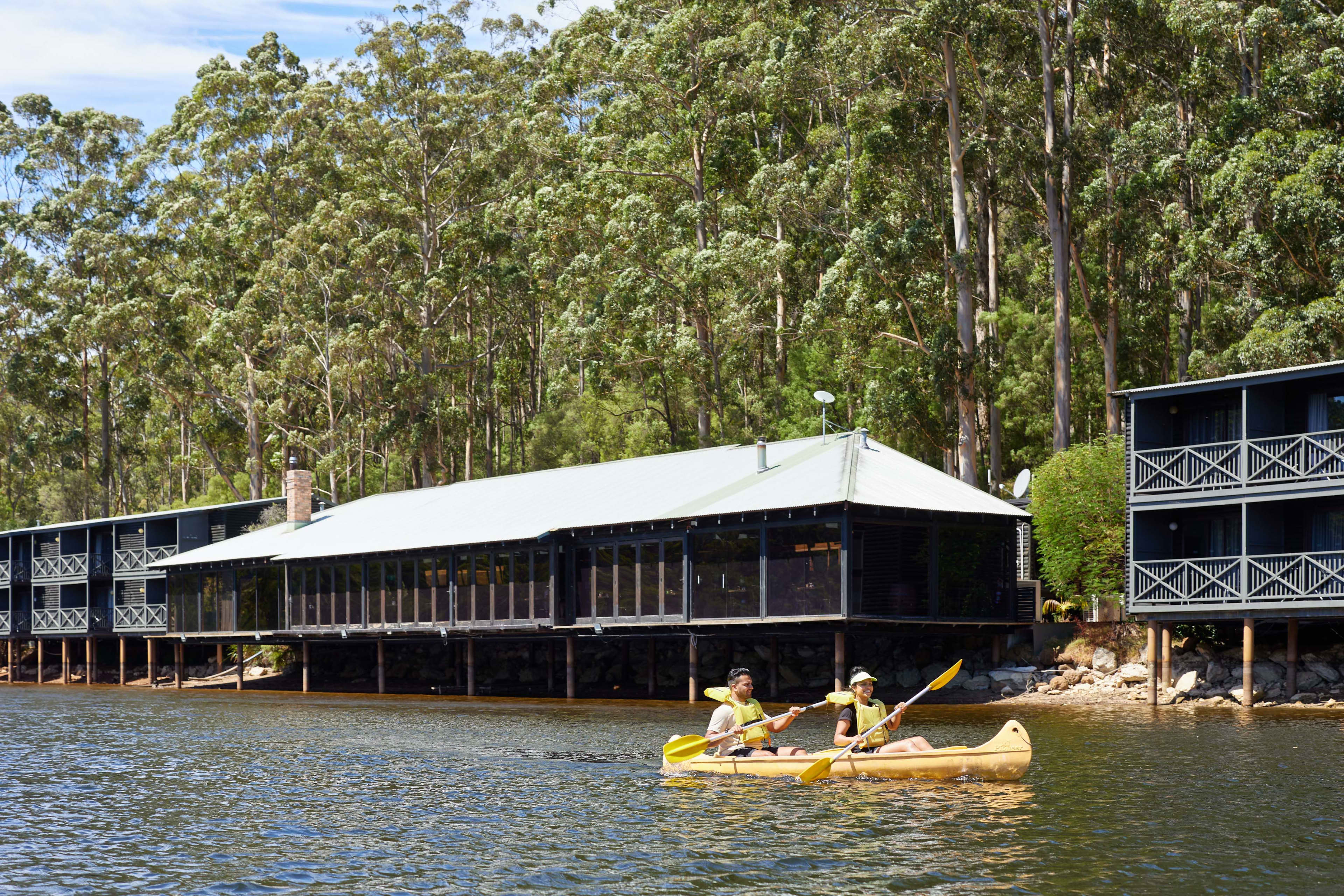 Front view of RAC Karri Valley Resort from across the lake