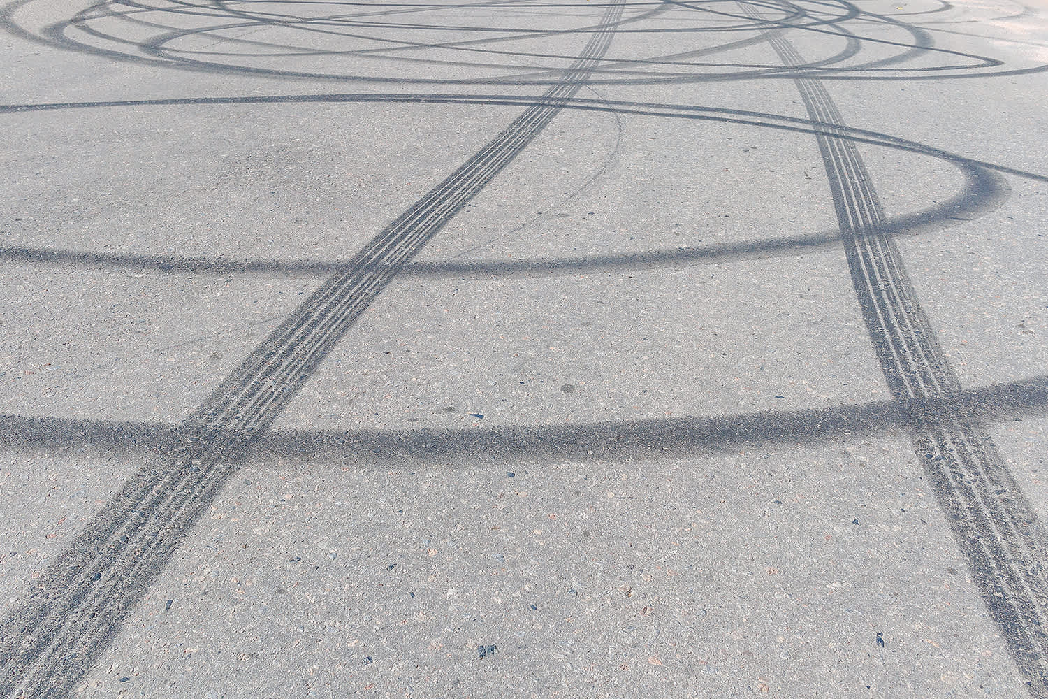 A road showing multiple tyre skid marks