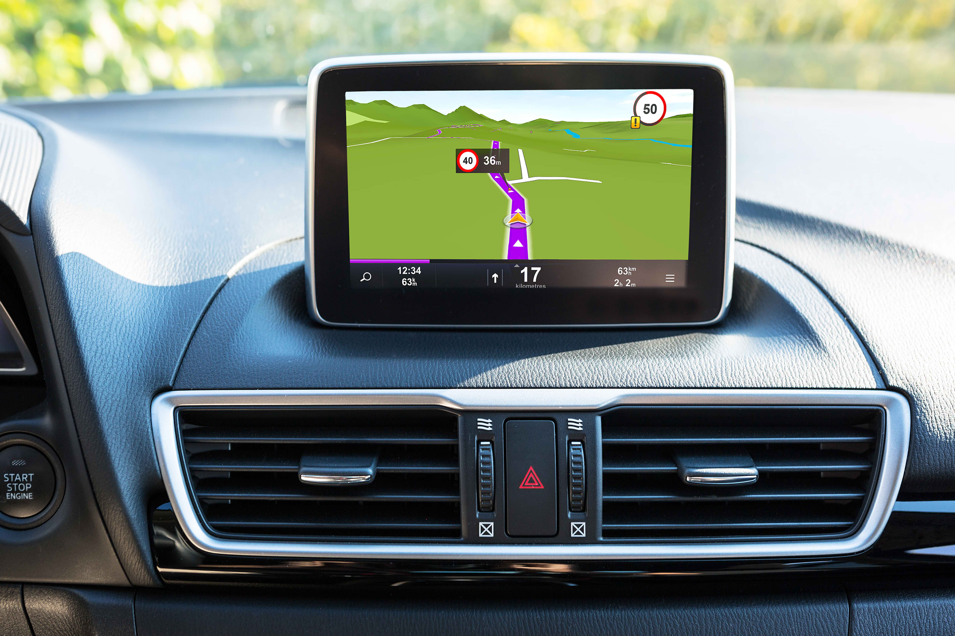 A car dashboard showing a GPS device