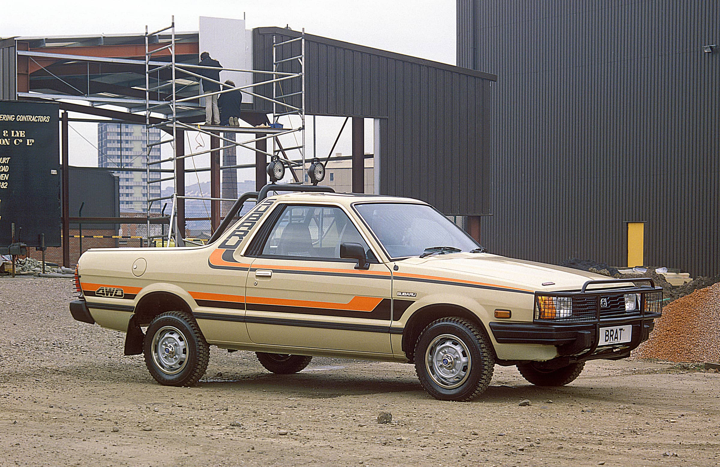 A brown Subaru Brumby on a work site