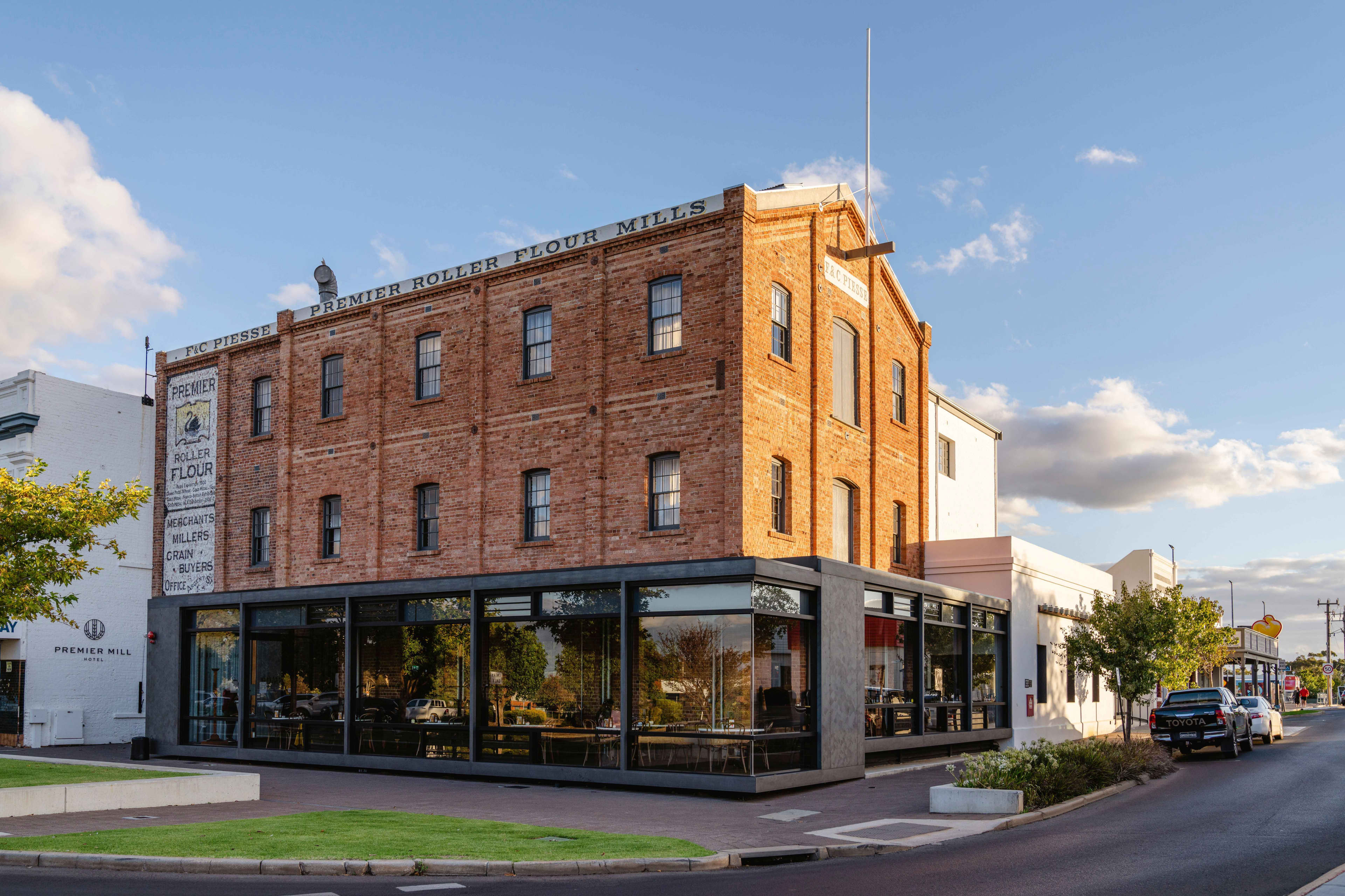 View of old flour mill in Katanning from outside with original brickwork and cafe on ground level.
