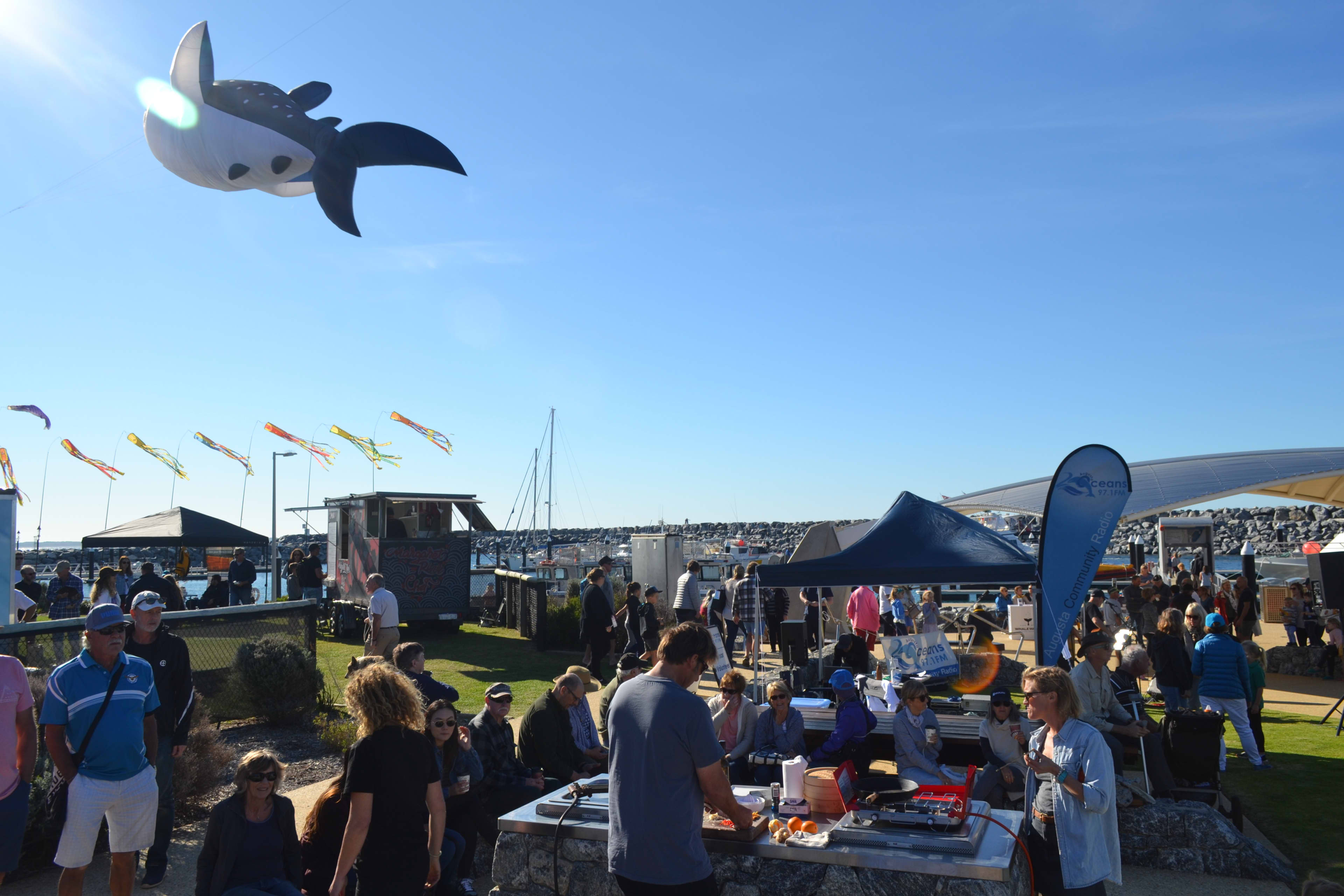Crowd at markets on waterfront for whale festival