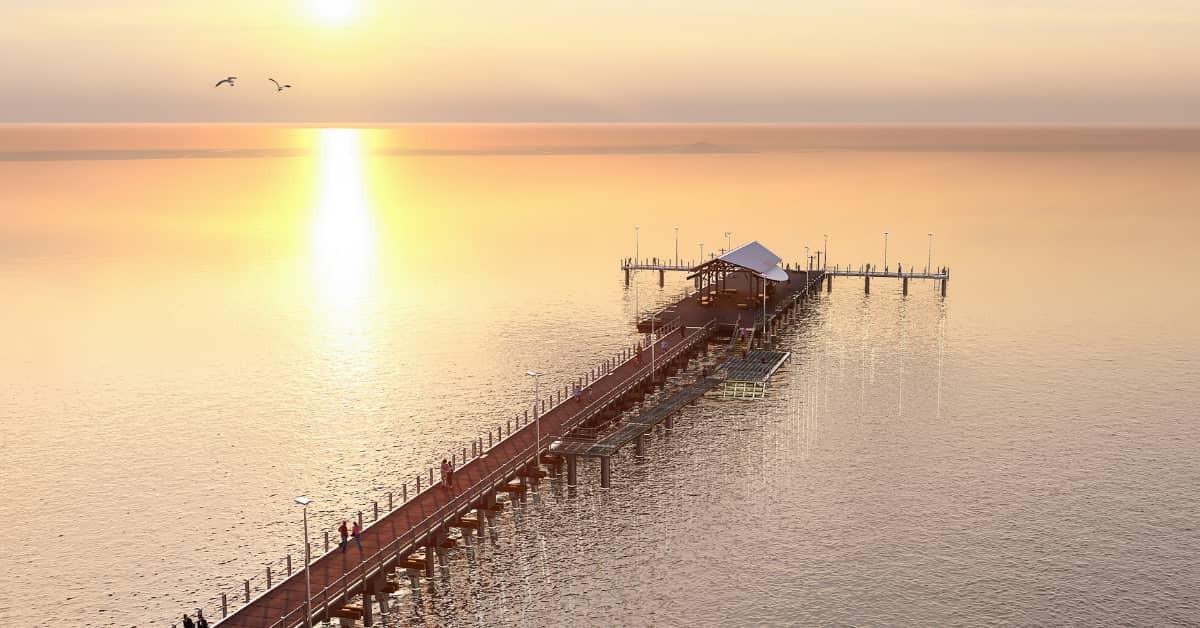 Artist impression of long jetty at sunset with T Head.