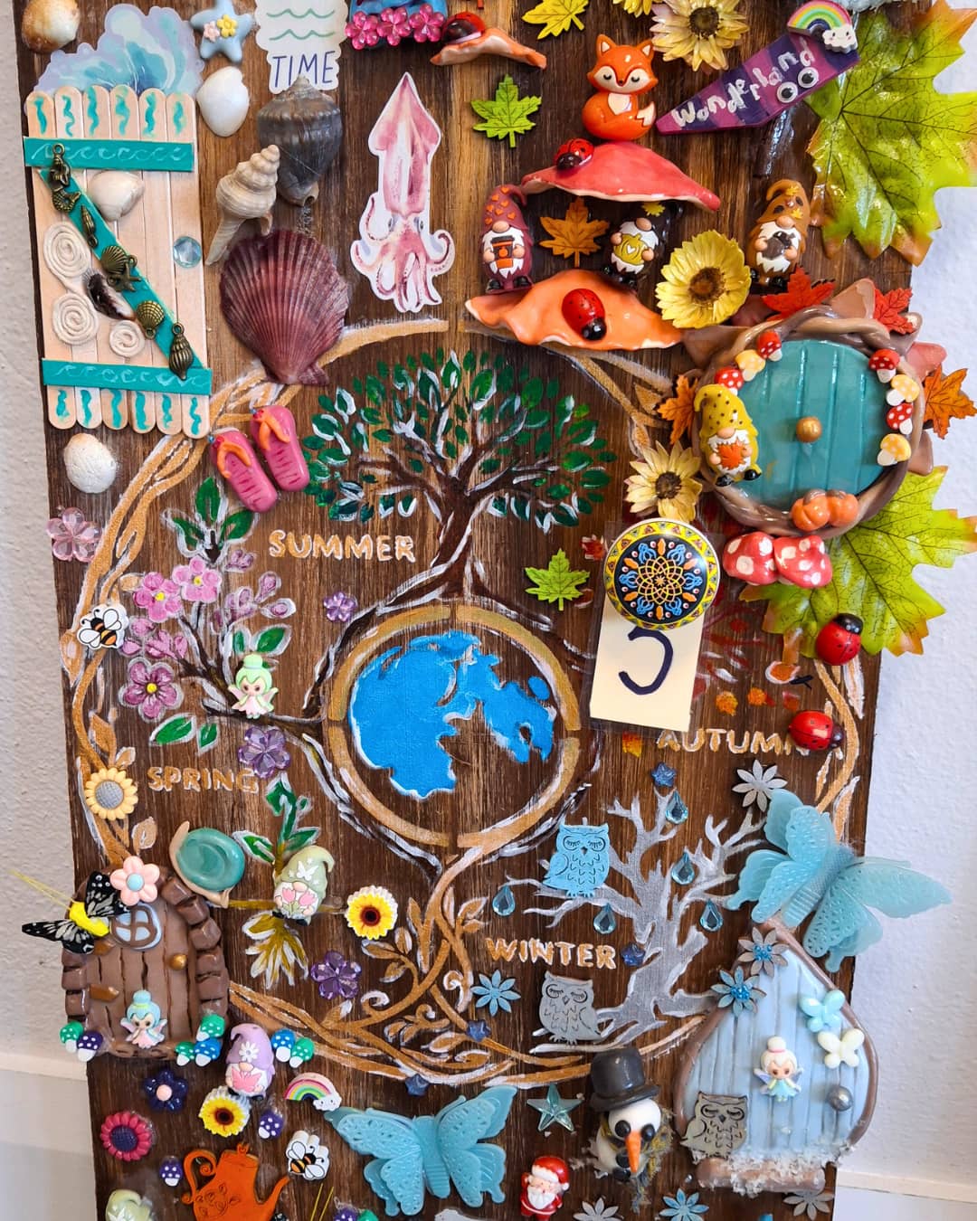 Door adorned and painted with all kinds of colours and trinkets.
