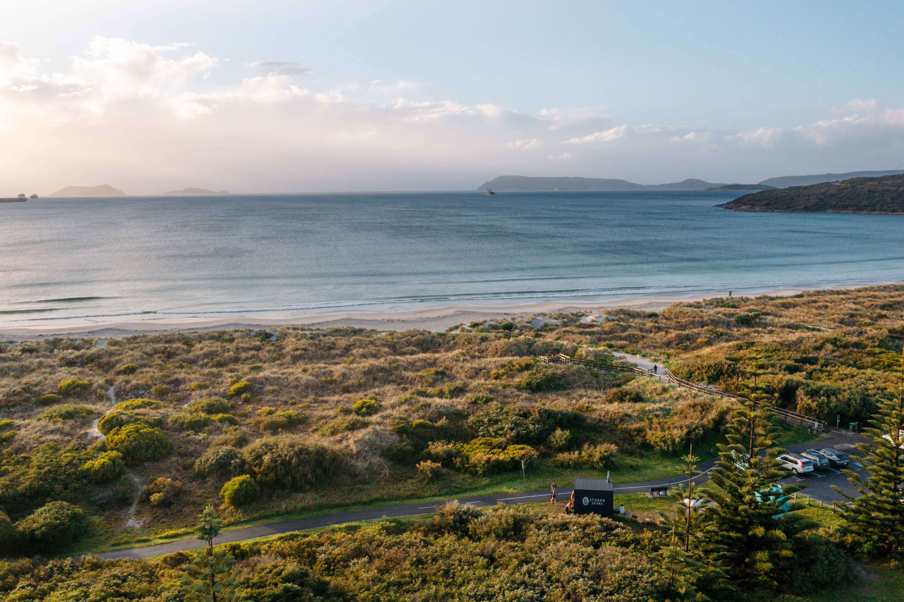 Mobile timber sauna tucked into bushland near beach
